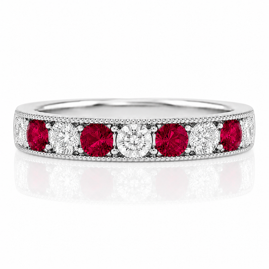 A silver ring with a row of red and white diamonds set in the band.