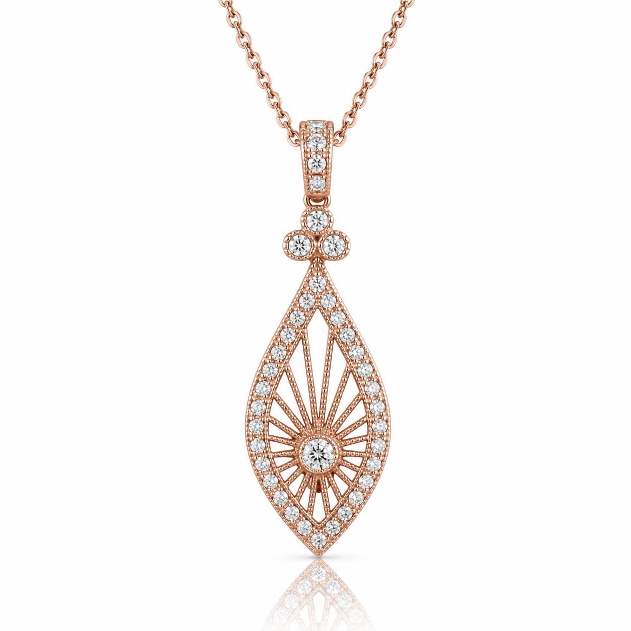A delicate rose gold necklace with a pendant featuring a central diamond surrounded by smaller diamonds arranged in a fan-like pattern.