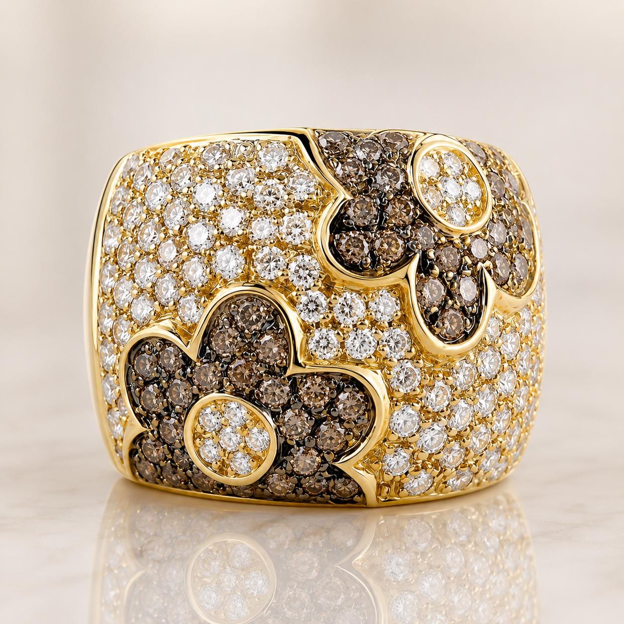 A gold ring adorned with diamonds in various shapes and sizes, including flowers and leaves, set against a light background.