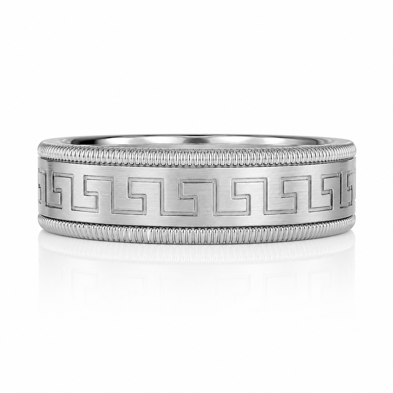 A silver-colored ring with a decorative pattern along the band.