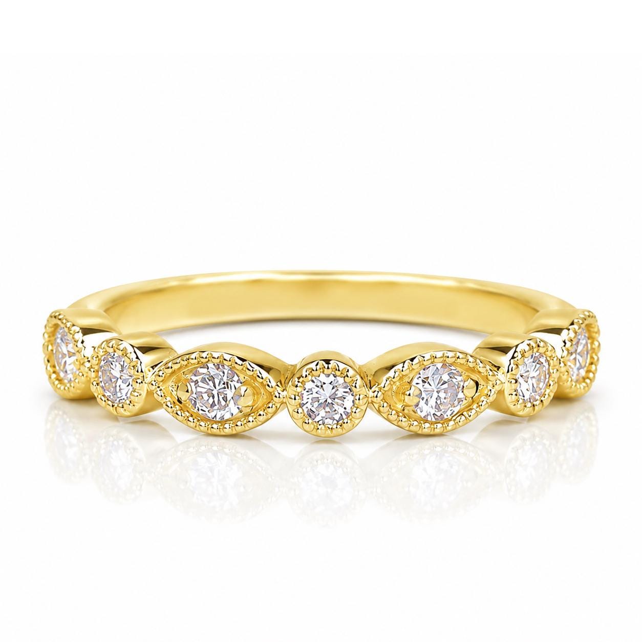 A gold ring with a row of small diamonds set in the center.