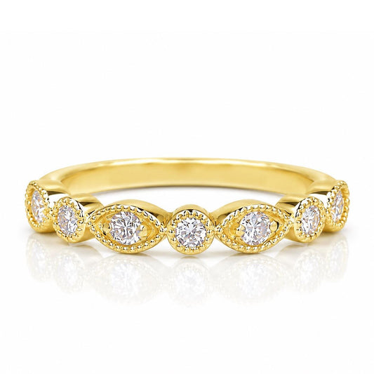 A gold ring with a row of small diamonds set in the center.