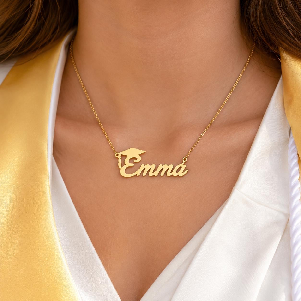 A gold necklace with a personalized name pendant, worn by a person.