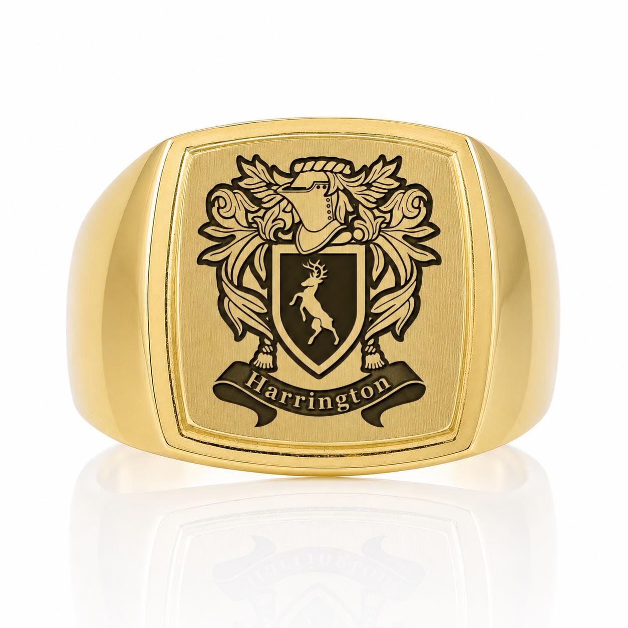 A gold ring with a crest and the name "Harrington" engraved on it.