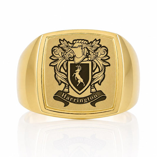 A gold ring with a crest and the name "Harrington" engraved on it.