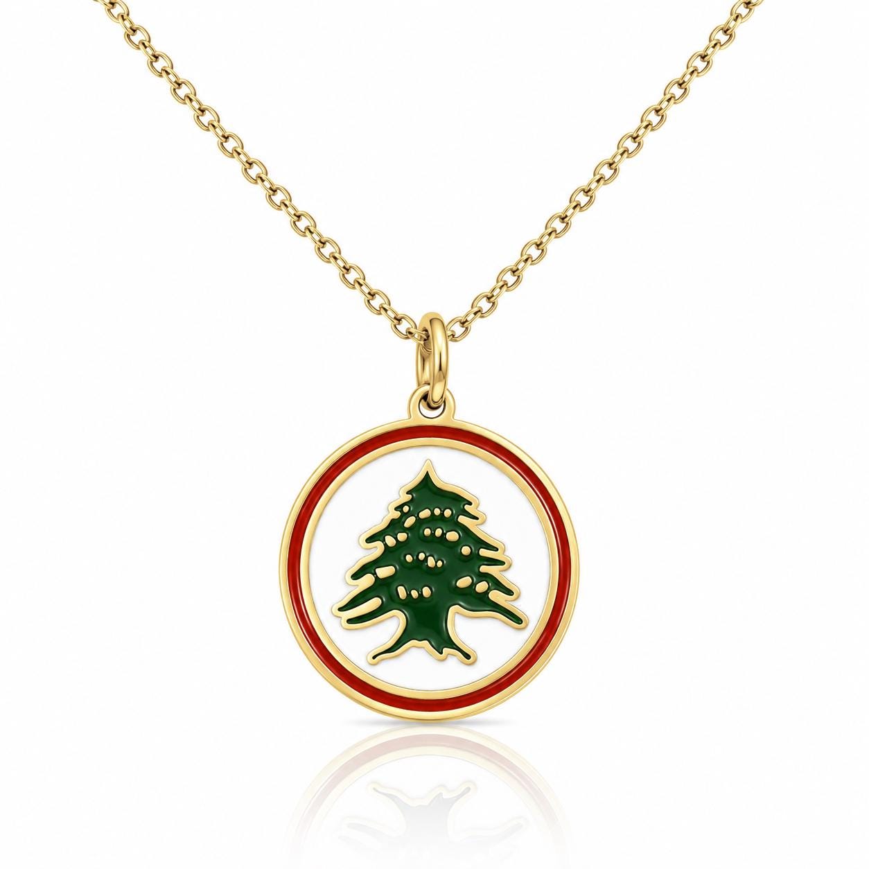 A gold-colored necklace with a circular pendant featuring a green tree design.