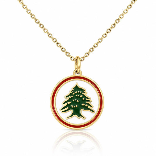A gold-colored necklace with a circular pendant featuring a green tree design.