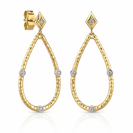 a pair of gold earrings with diamond accents, set in a diamond-shaped design.