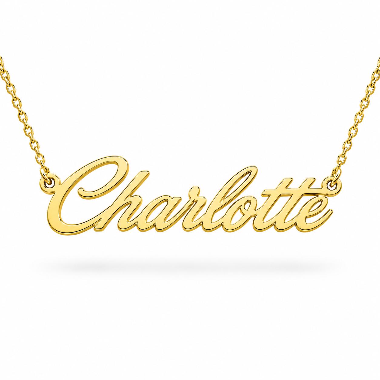 A gold-colored necklace with the name "Charlotte" engraved on it.