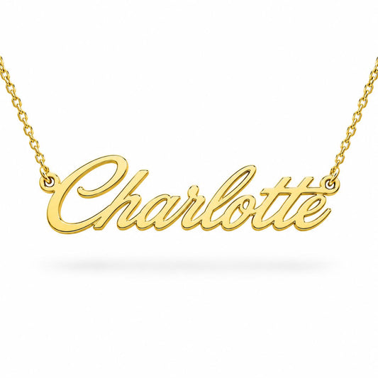 A gold-colored necklace with the name "Charlotte" engraved on it.