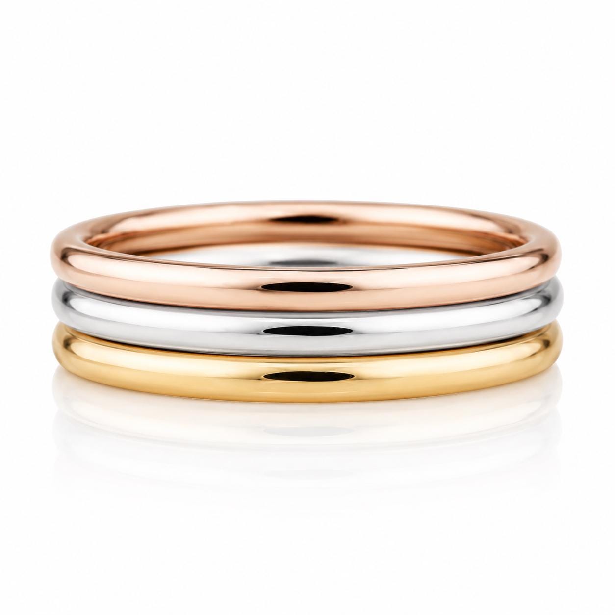 A stack of three rings, each with a different color: gold, silver, and copper.