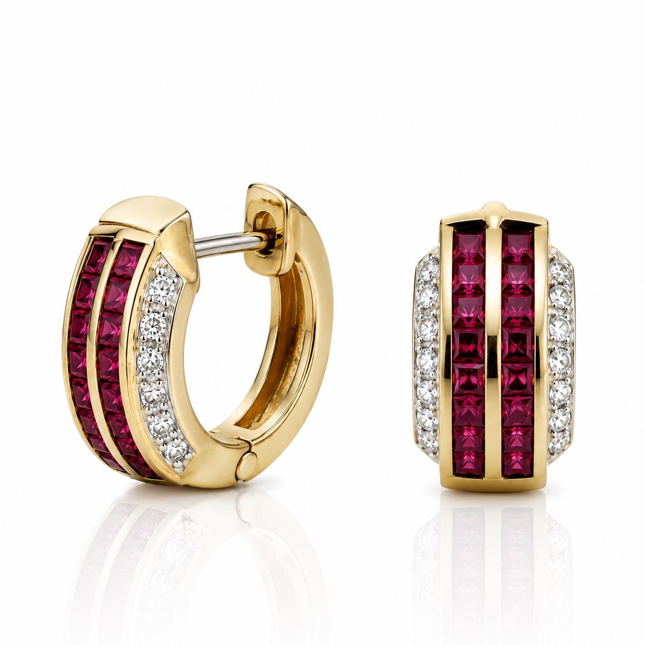 two gold earrings with red gemstones, including diamonds.