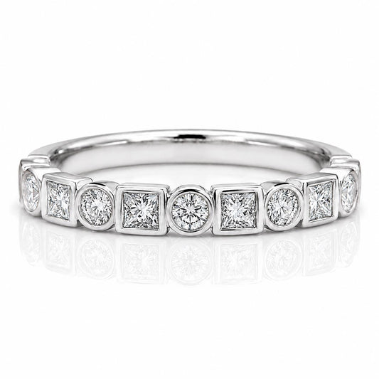 A silver ring with a row of diamonds set in a geometric pattern.
