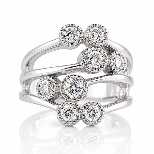 A silver ring with a unique design featuring multiple diamond-encrusted rings stacked on top of each other.