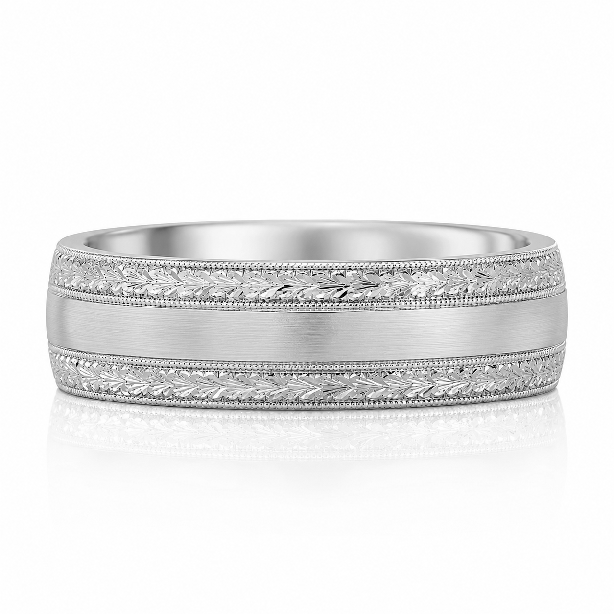 A silver-colored ring with a decorative band featuring leaf-like patterns.