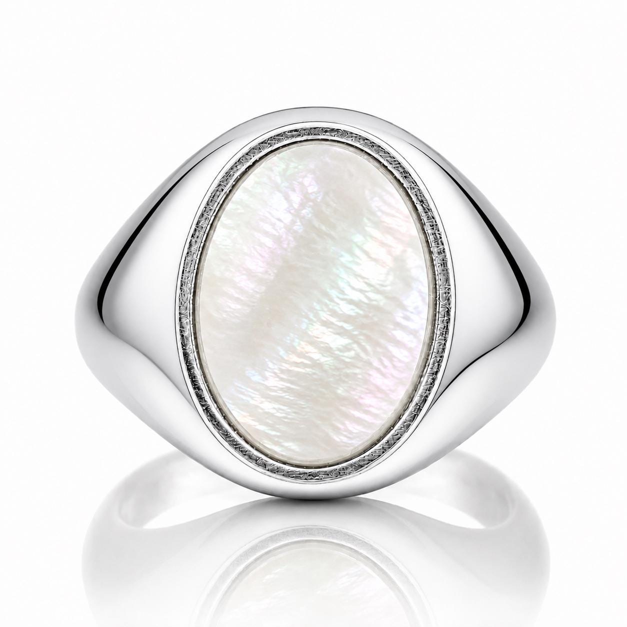A silver ring with a large oval-shaped pearl in the center.