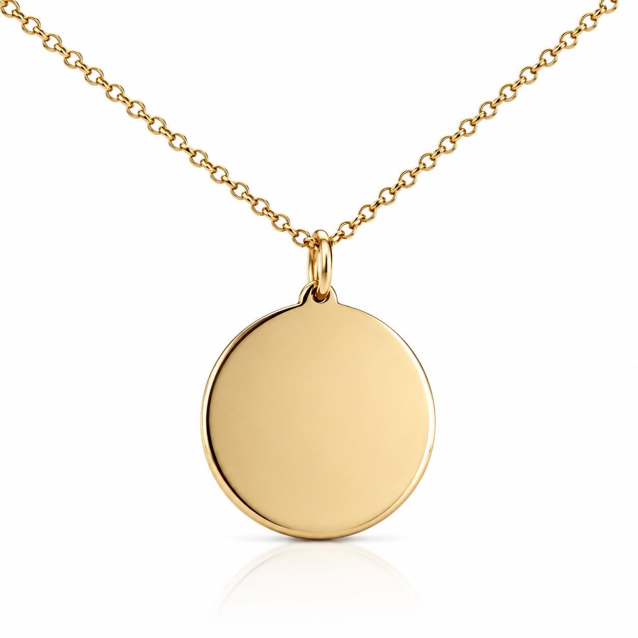 A gold-colored necklace with a round pendant hanging from a chain.