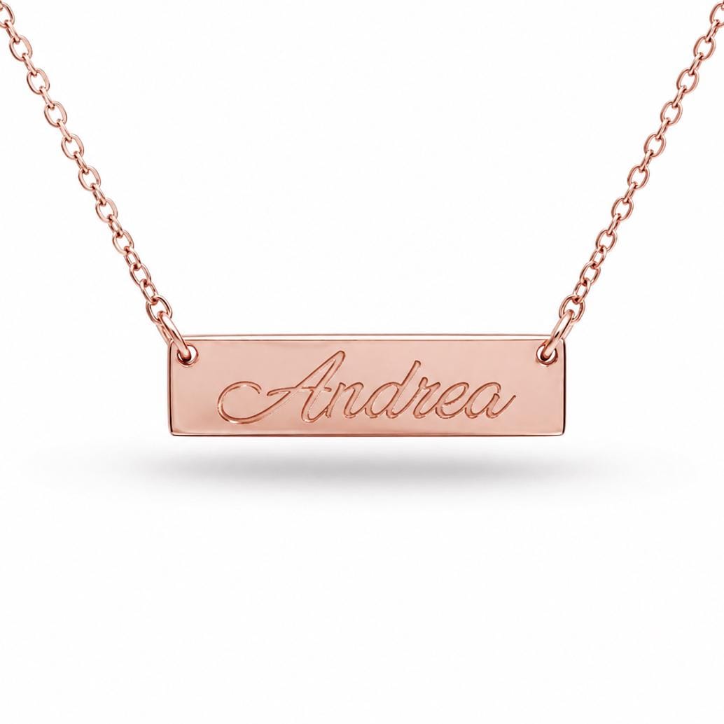 A necklace with a rectangular pendant engraved with the name "Andrea".