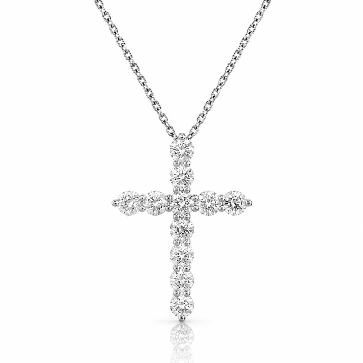 A silver cross pendant necklace with numerous sparkling diamonds.