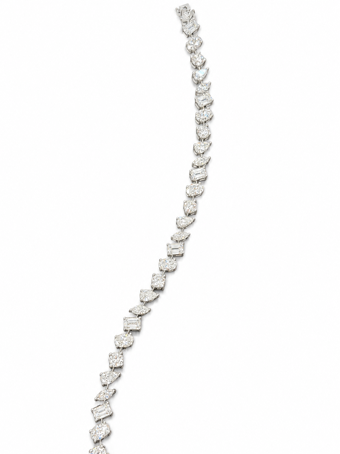 A long, elegant silver necklace with numerous small diamonds arranged in a curved pattern.
