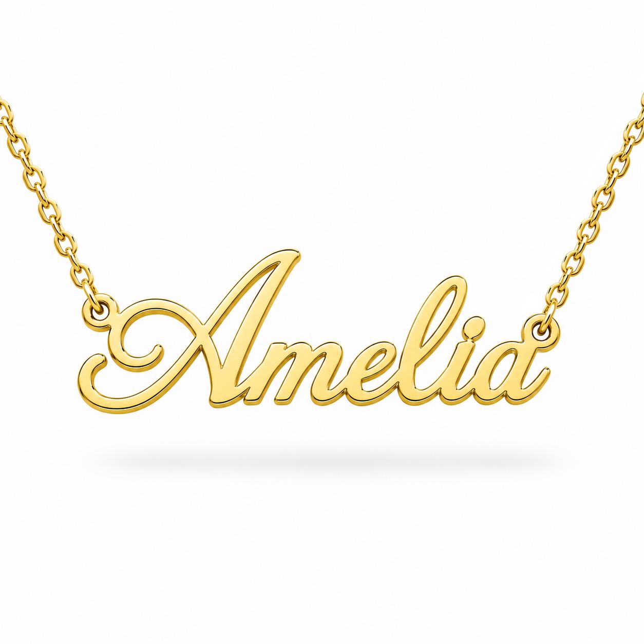 A gold-colored necklace with the name "Amelia" engraved on it.