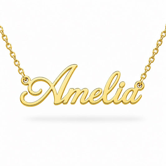 A gold-colored necklace with the name "Amelia" engraved on it.