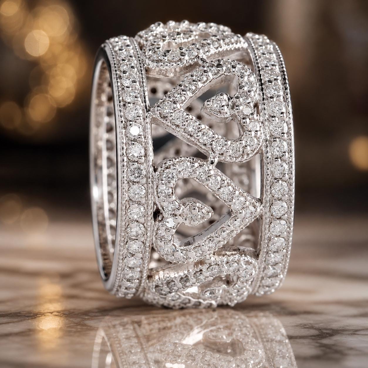 A close-up image of a diamond-encrusted ring with a heart-shaped design, displayed on a reflective surface.