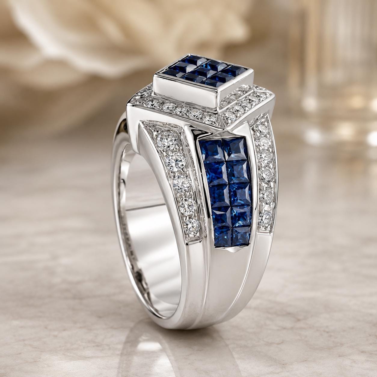 A silver ring with a large blue gemstone and smaller blue gemstones set in it, surrounded by smaller diamonds.