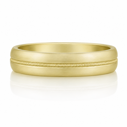 A gold ring with a simple, elegant design.