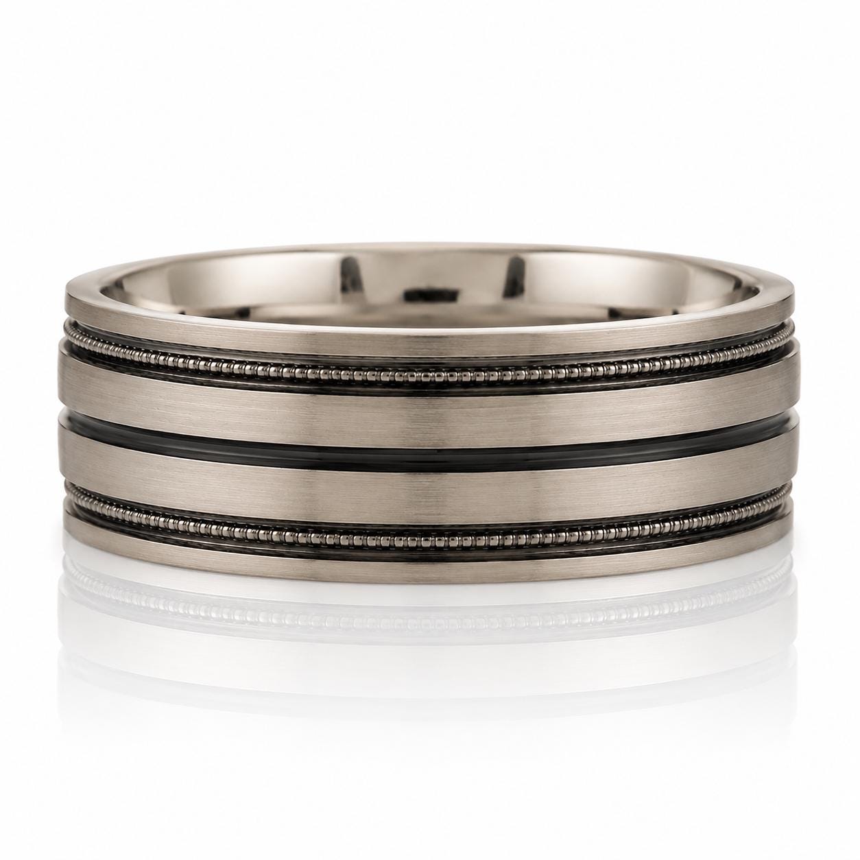 A silver-colored ring with three horizontal bands, one of which is black.