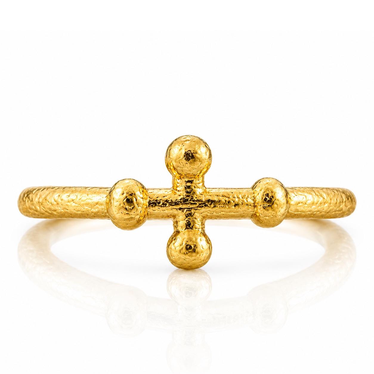 A gold ring with a unique design featuring three small balls arranged in a cross shape.