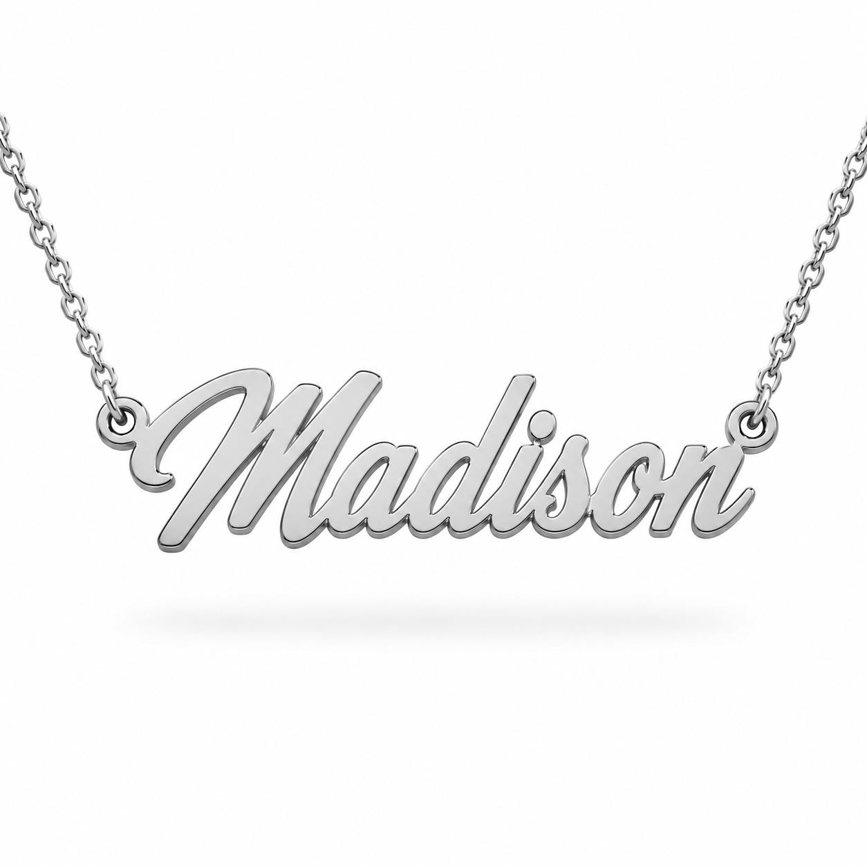 A silver necklace with the name "Madison" engraved on it.