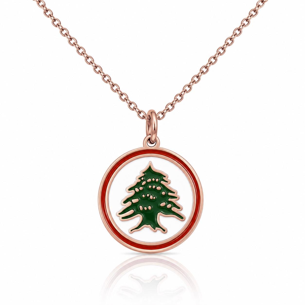 A necklace with a pendant featuring a green tree design encased within a red circle.