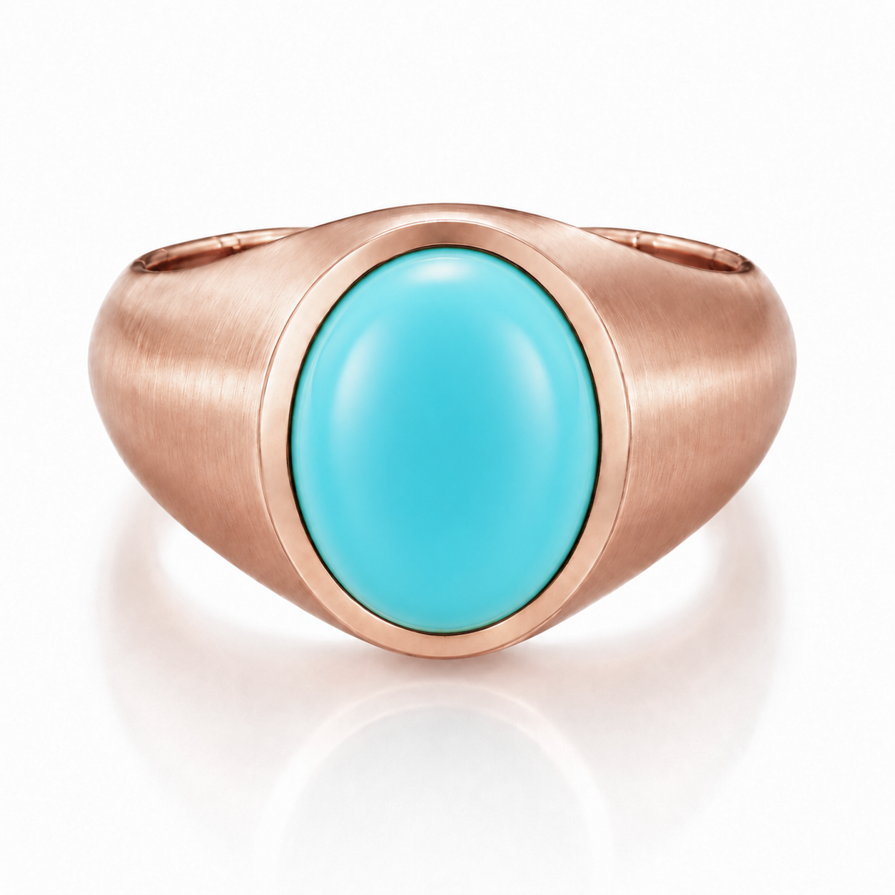 A rose gold ring with a turquoise stone set in the center.