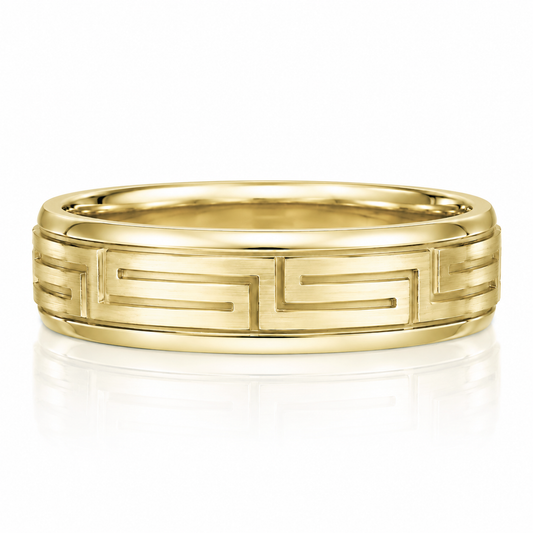 A gold ring with a Greek key pattern design.