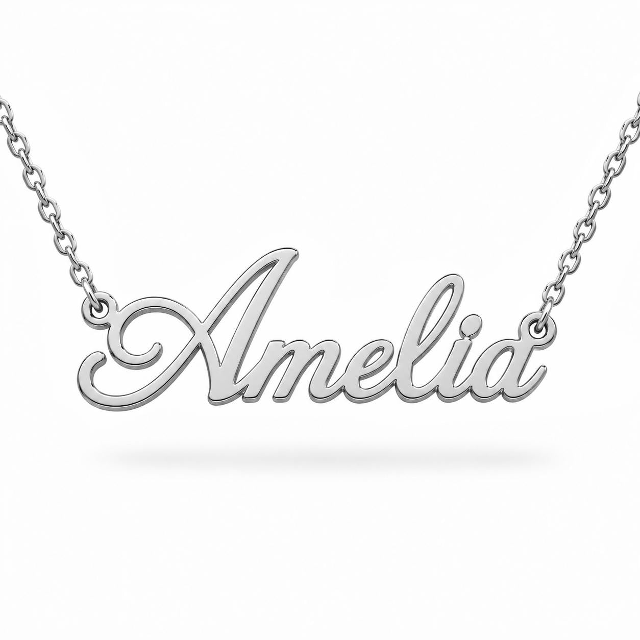 A silver necklace with the name "Amelia" engraved on it.