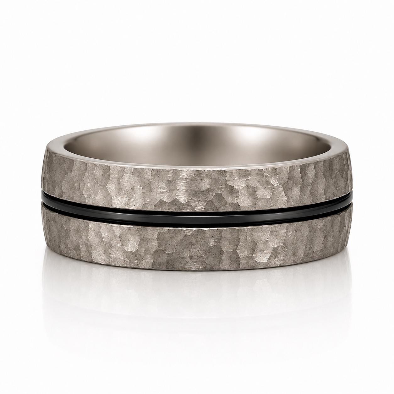 A silver ring with a black band, showcasing a textured and metallic appearance.