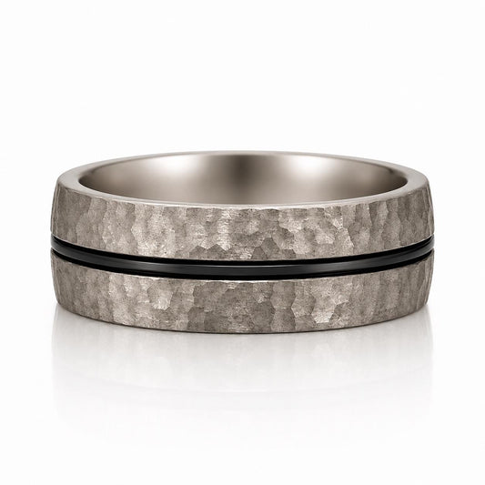 A silver ring with a black band, showcasing a textured and metallic appearance.