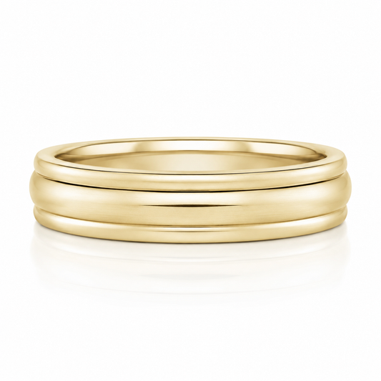 A gold ring with a simple, elegant design.