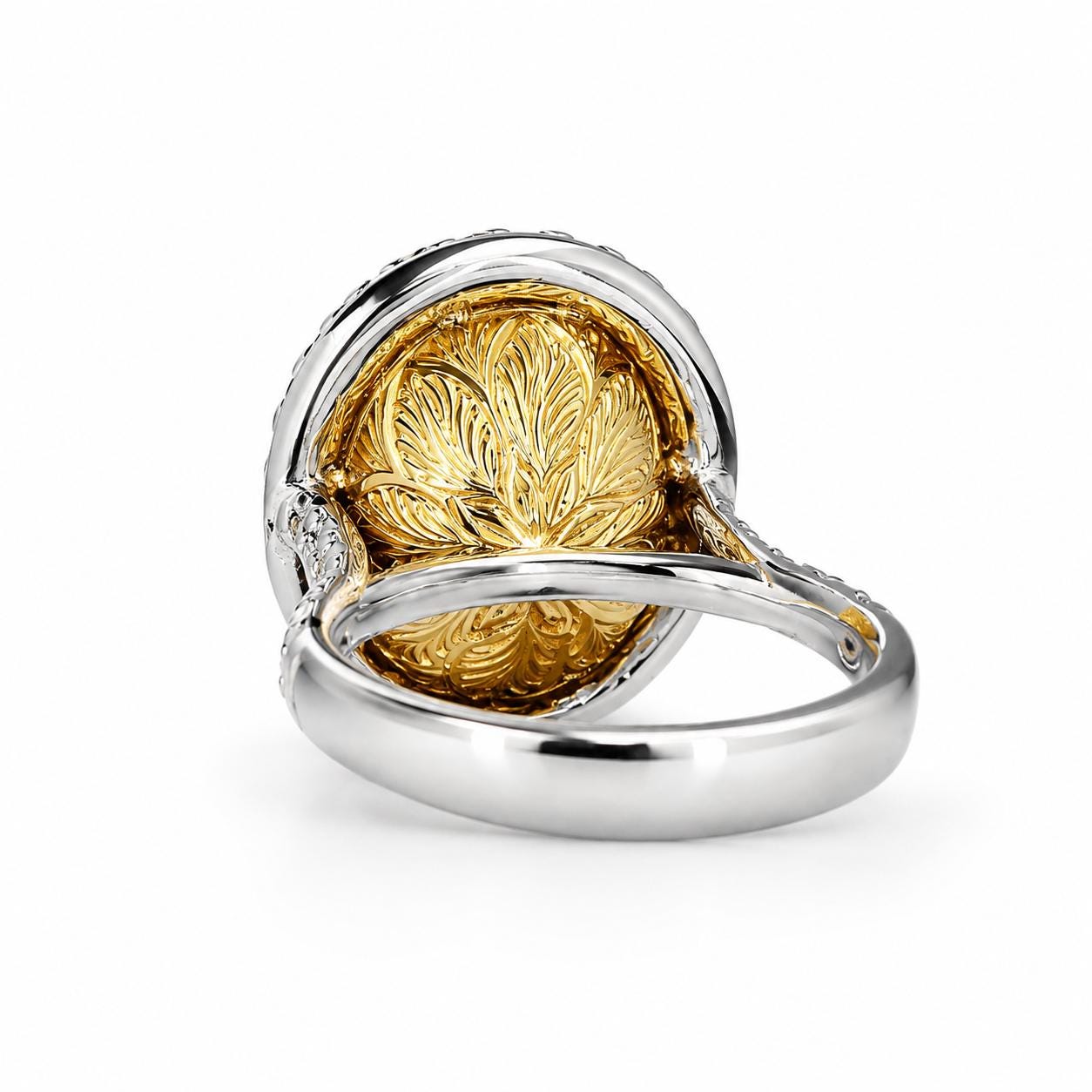 A silver ring with a large, intricately designed gold flower at the center.