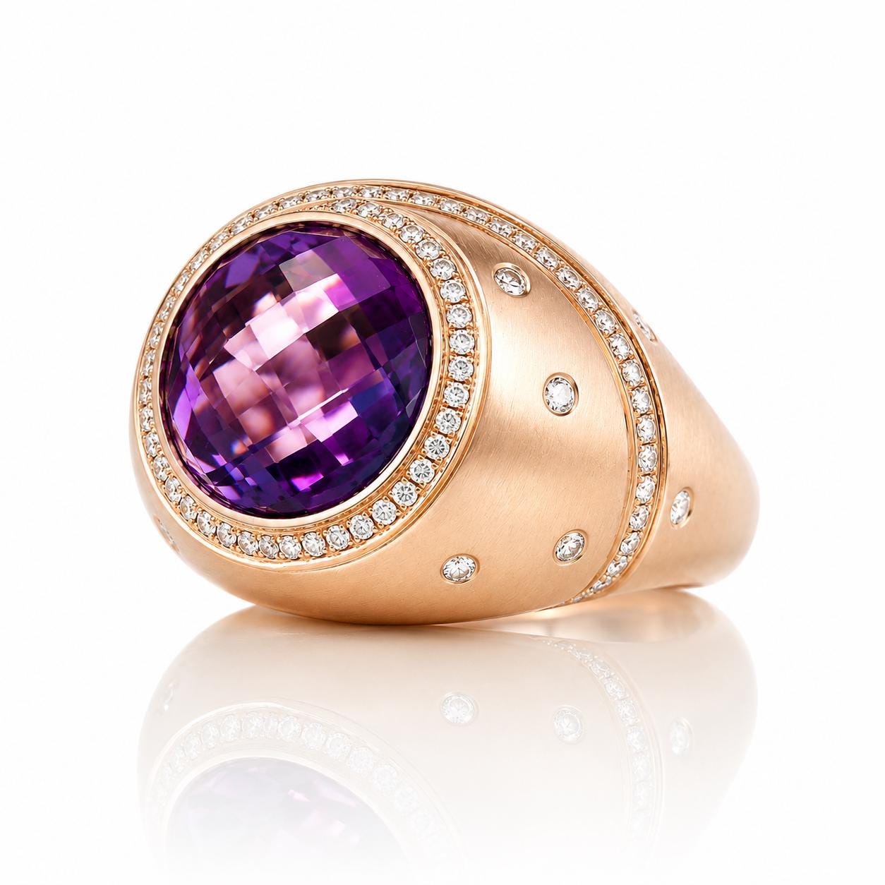 A gold ring with a large oval-shaped purple gemstone set in the center, surrounded by smaller diamonds.