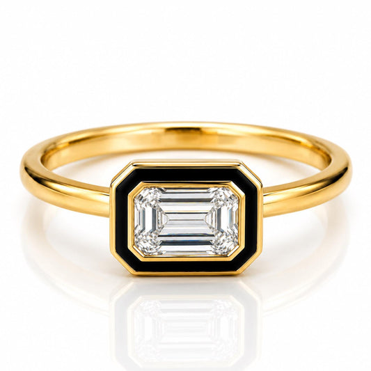 A gold ring with a large, clear gemstone set in the center.