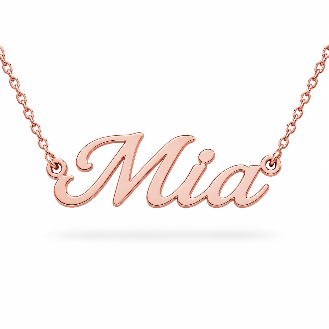 A necklace with the name "Mia" engraved on it.