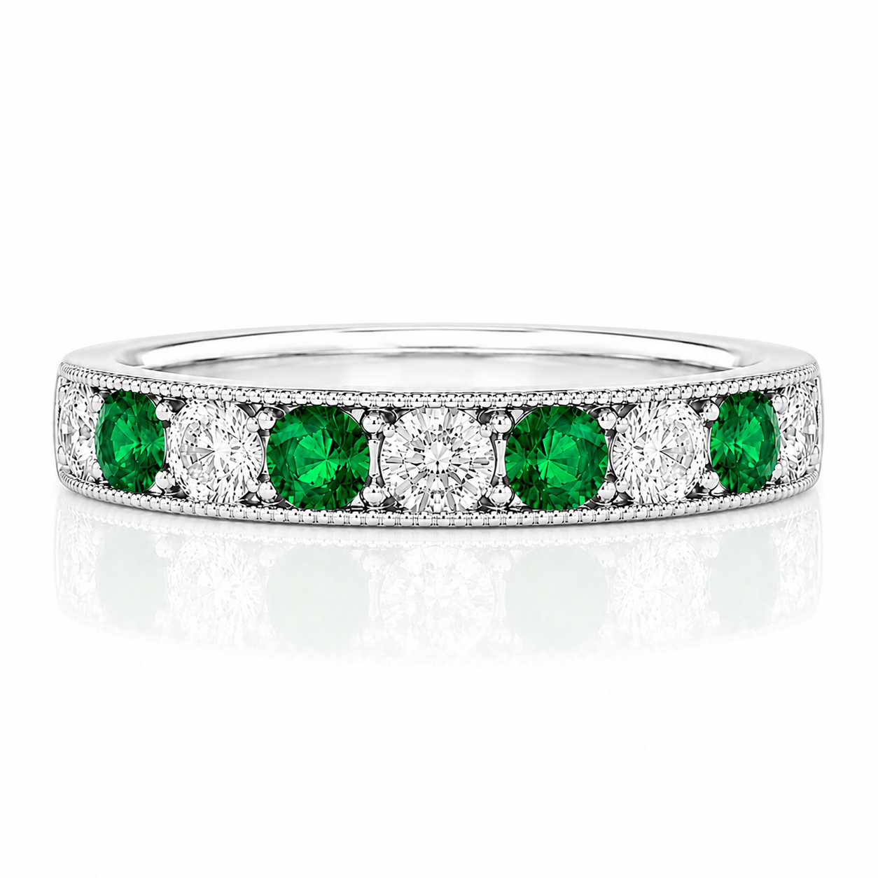 A silver band ring with a row of green and white diamonds set in it.