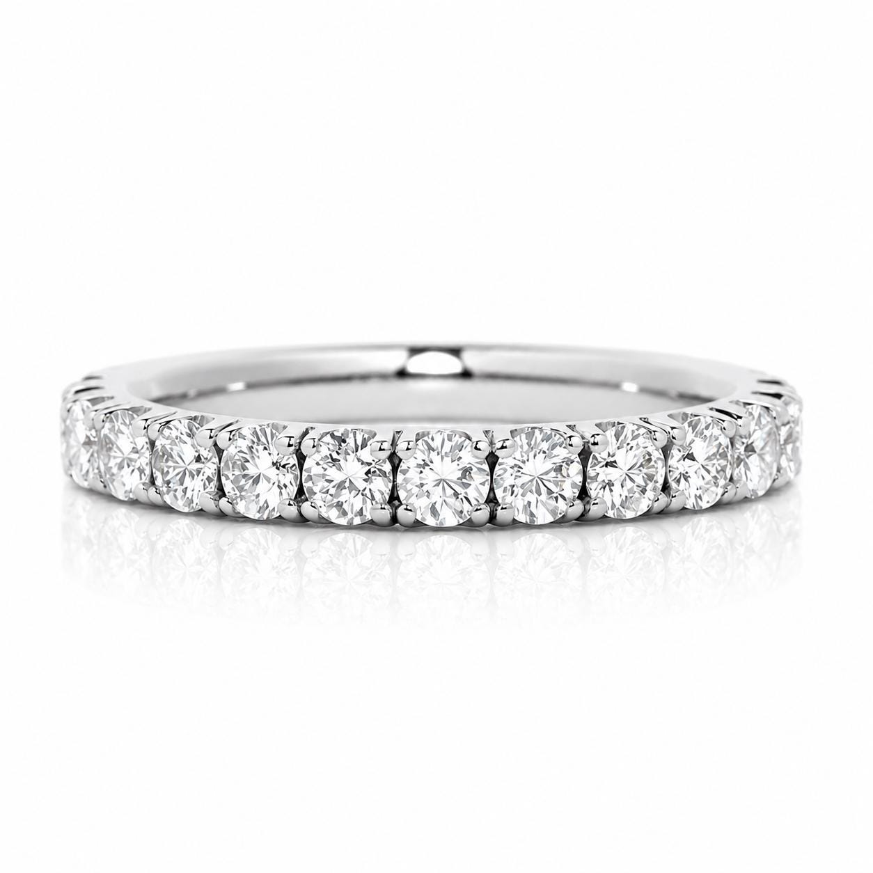 A diamond-encrusted band with a row of round diamonds set in a silver-colored metal.