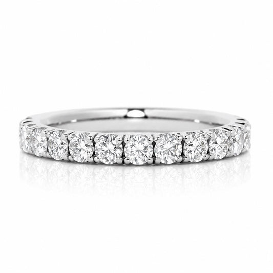 A diamond-encrusted band with a row of round diamonds set in a silver-colored metal.