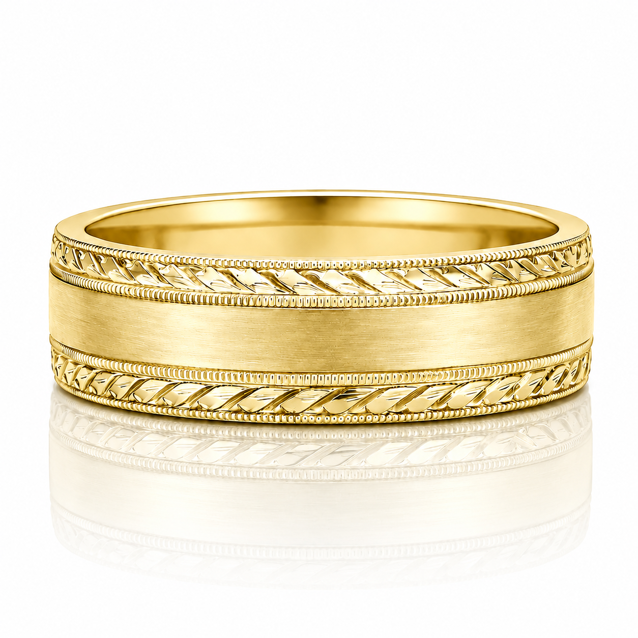 A gold wedding band with a decorative band design and a smooth, shiny surface.