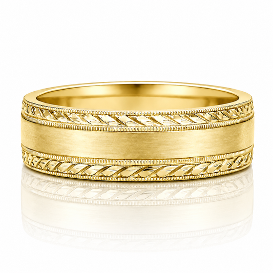 A gold wedding band with a decorative band design and a smooth, shiny surface.