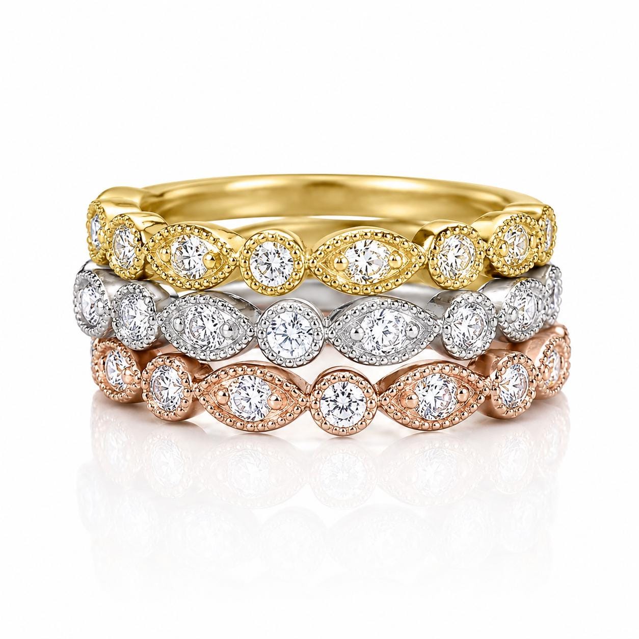 A ring with a series of diamond-encrusted bands, each with a different color (gold, silver, and rose gold).