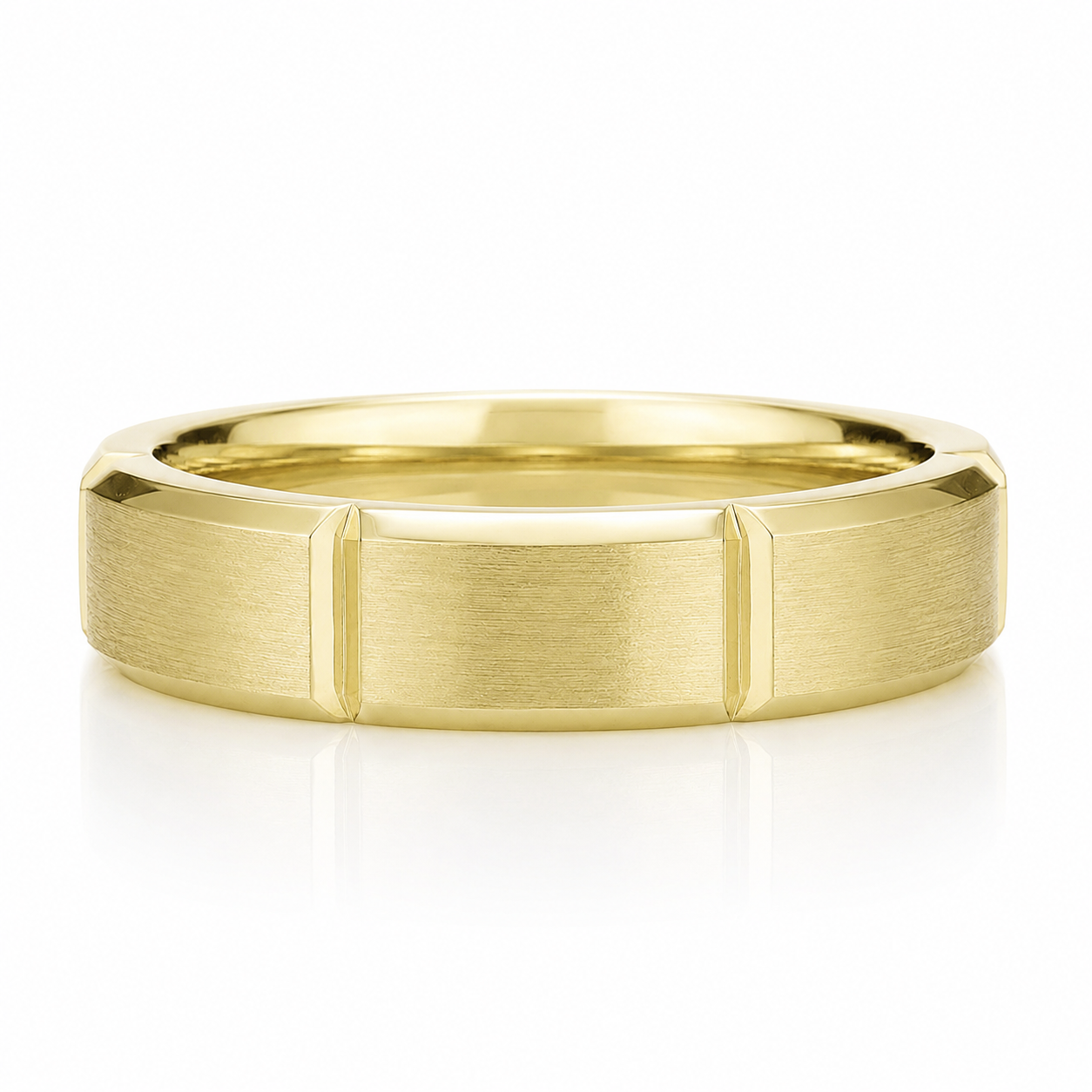A gold ring with a textured band design.